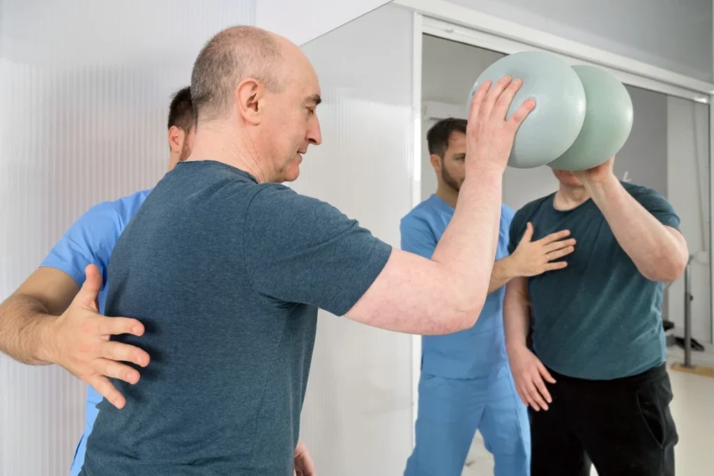Man in strength session with nurse