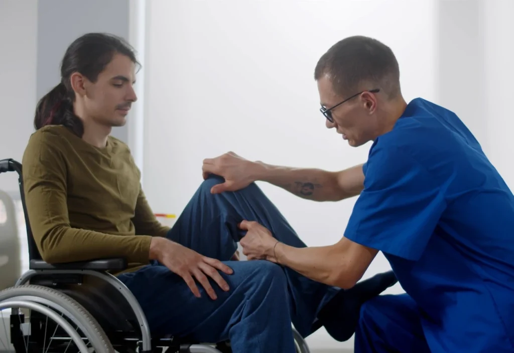 Disabled man in wheelchair with nurse
